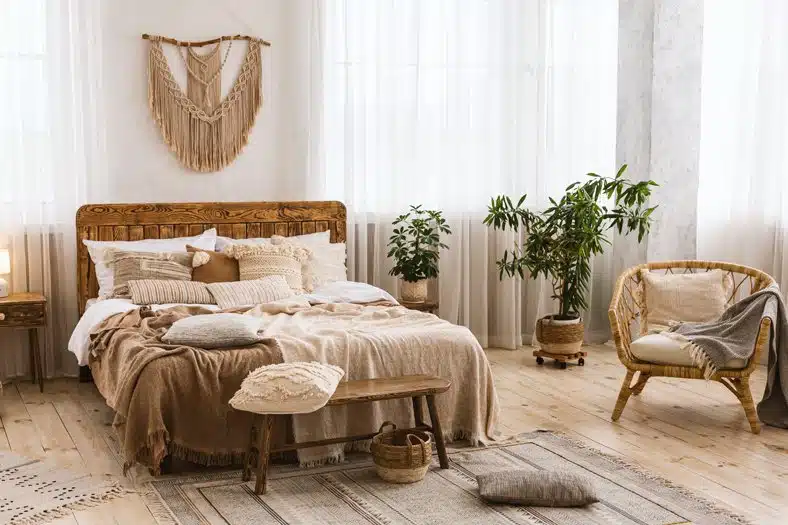 Bedroom interior concept. Cute design with double bed, plants in pots and large windows