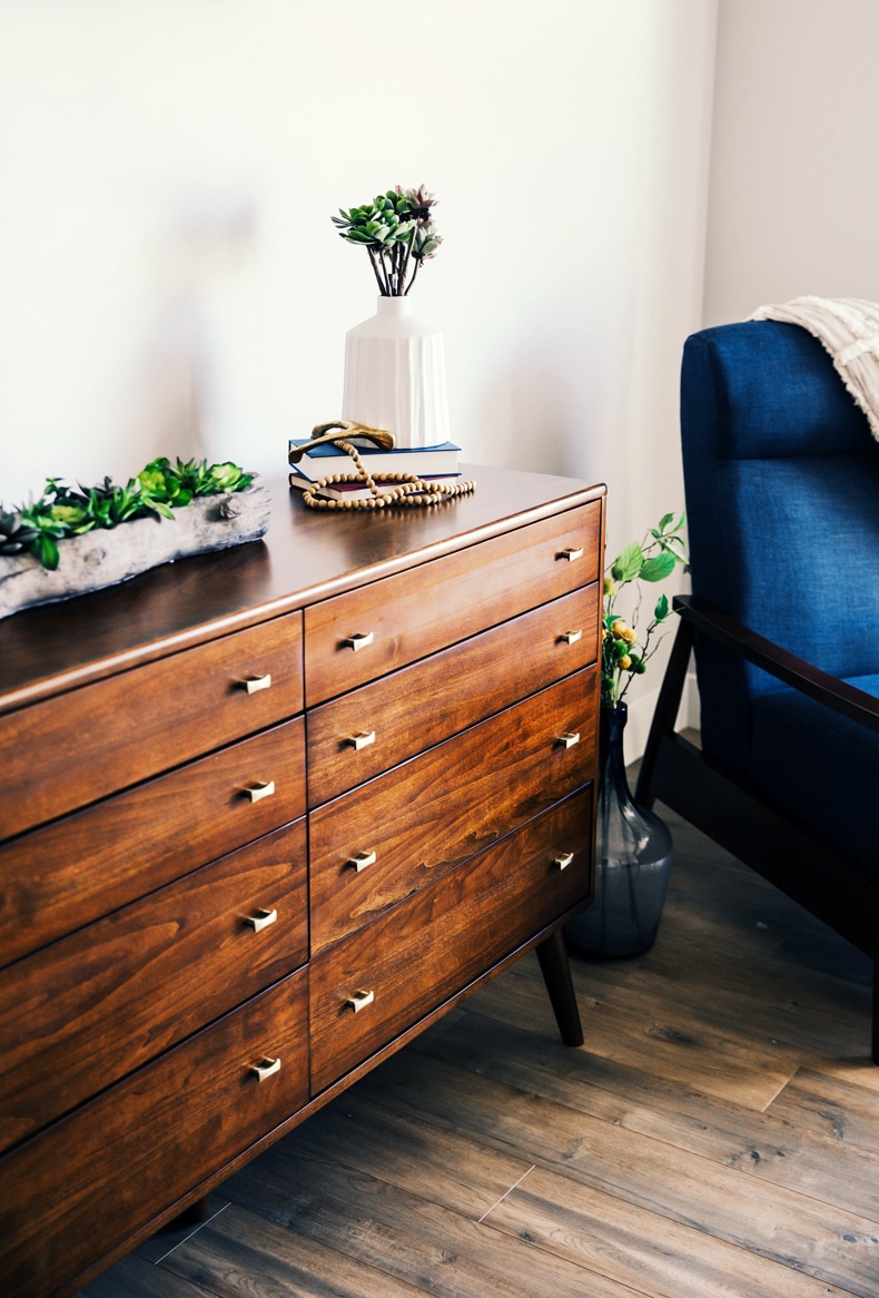 Creating a cozy minimalist home, consider rustic or vintage furniture