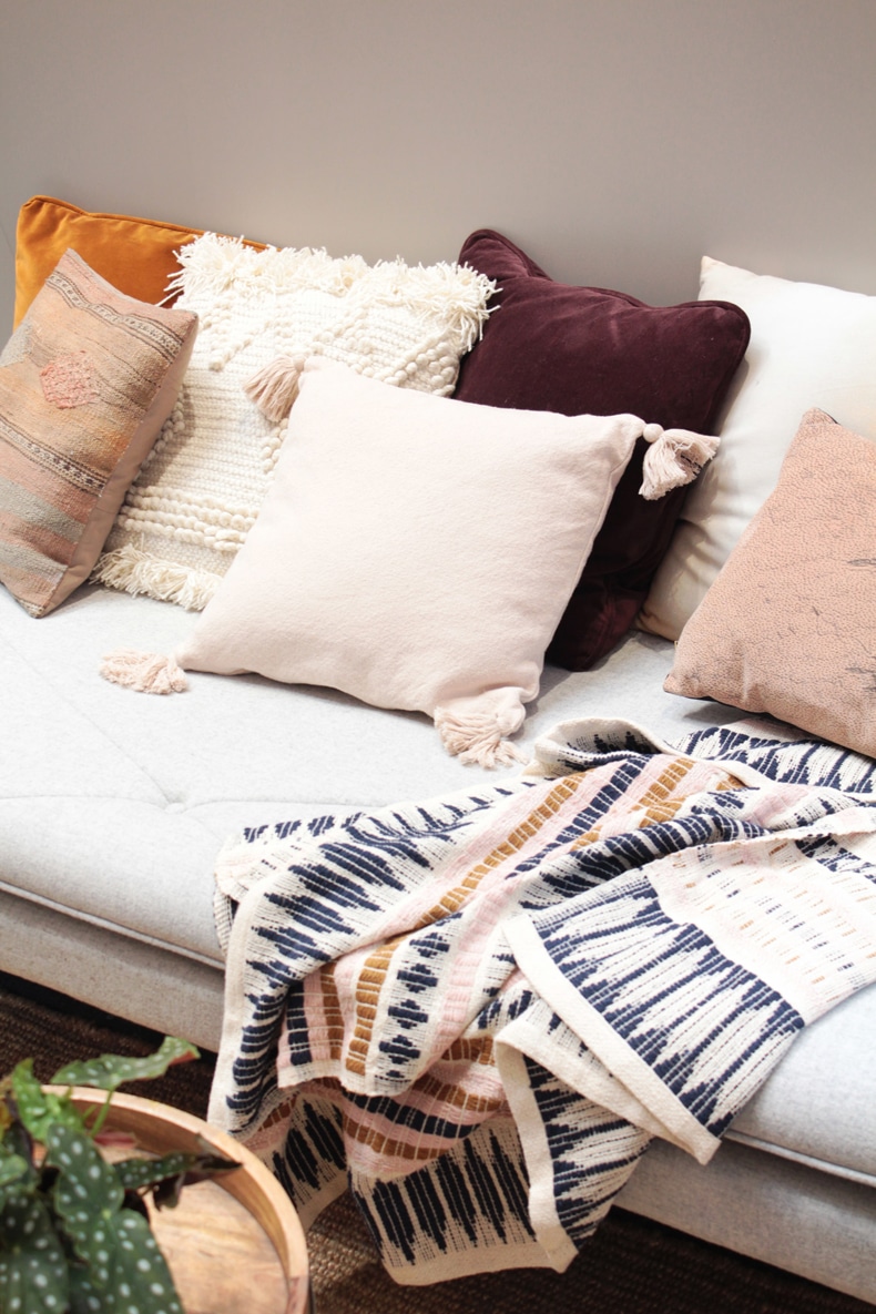 Creating a cozy minimalist home, use cozy textures & textiles