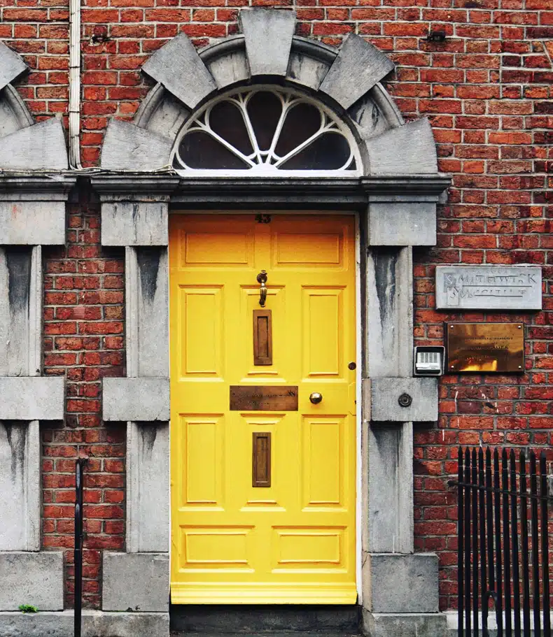 red brick front door yellow color