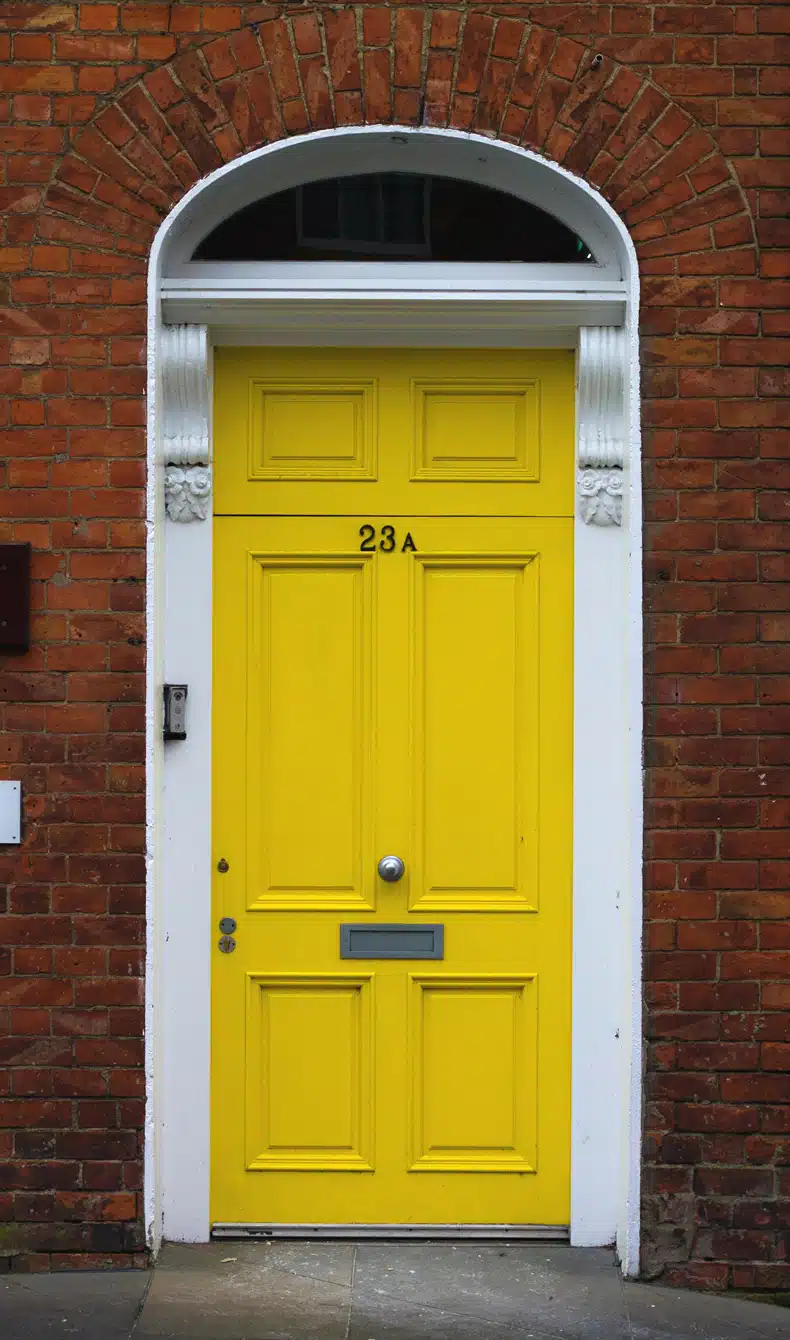 yellow door color for brick house