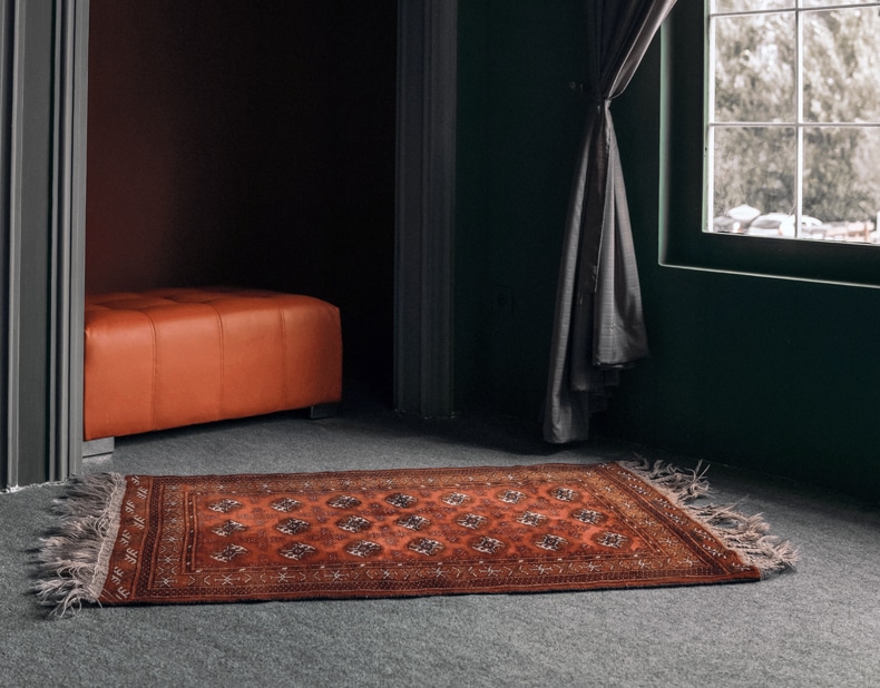 burnt orange rug for grey floor 
