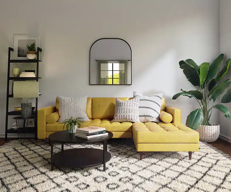 living room with gray wall and mustard sofa and back coffee table