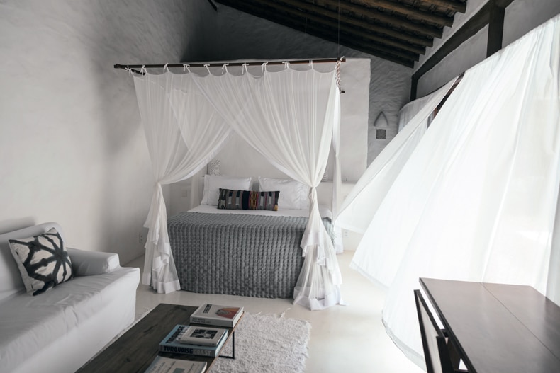 minimalist boho bedroom with white wall and empty space