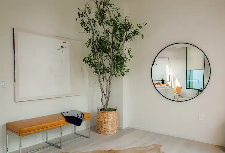 a mirror to a large wall space in living room