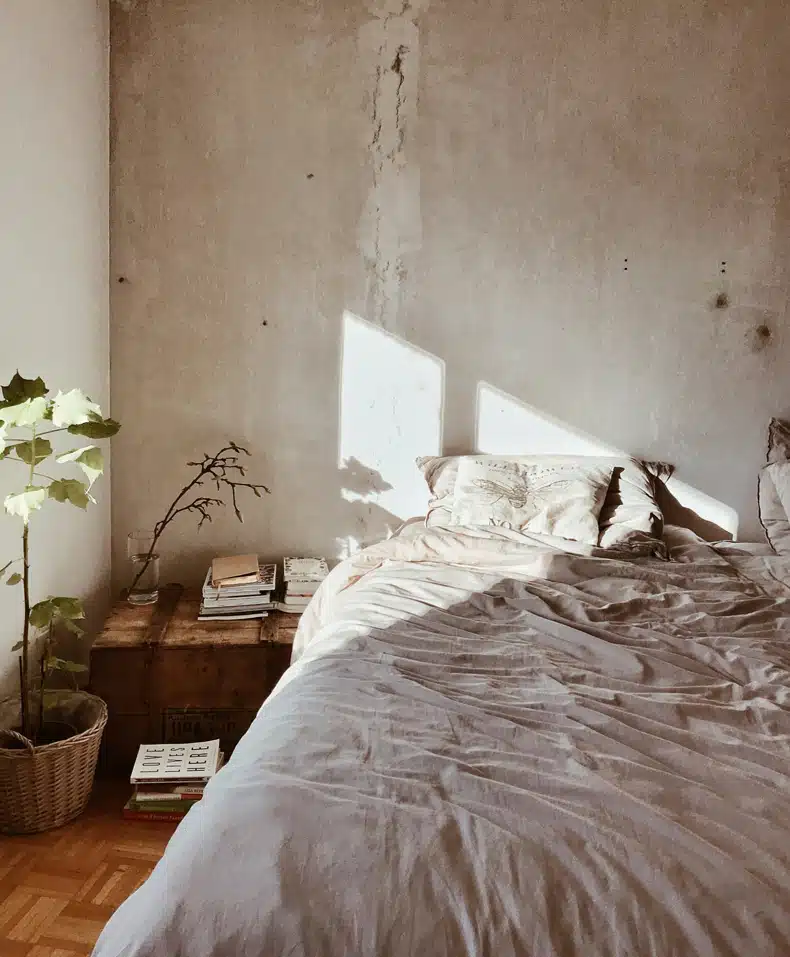 sunshine through a window in a japandi minimalist bedroom