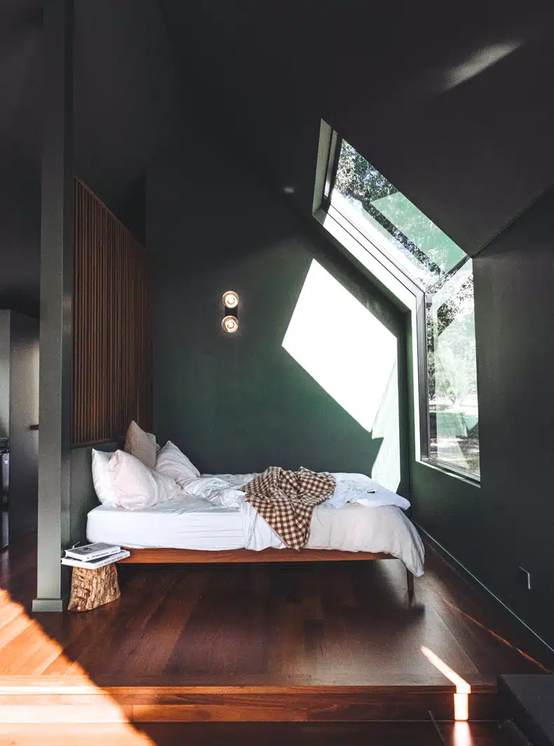 bed in front of a window