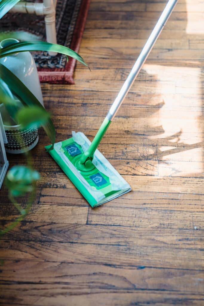 cleaning the hardwood floor with a mop