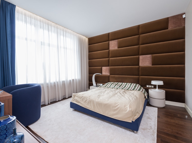 a bedroom with a soundproof wall