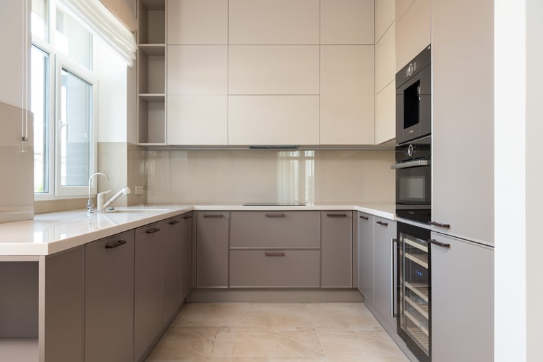 light taupe cabinets in ultra modern kitchen