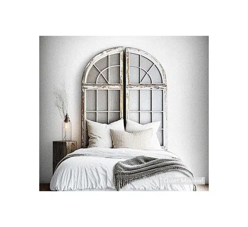 A bed with a unique window headboard repurposed from old vintage windows.