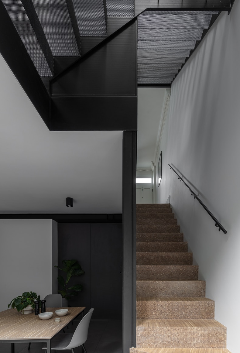 A muted color palette throughout the house accentuates the monochromatic staircase and highlights the quality and color of the natural light that streams into the property.