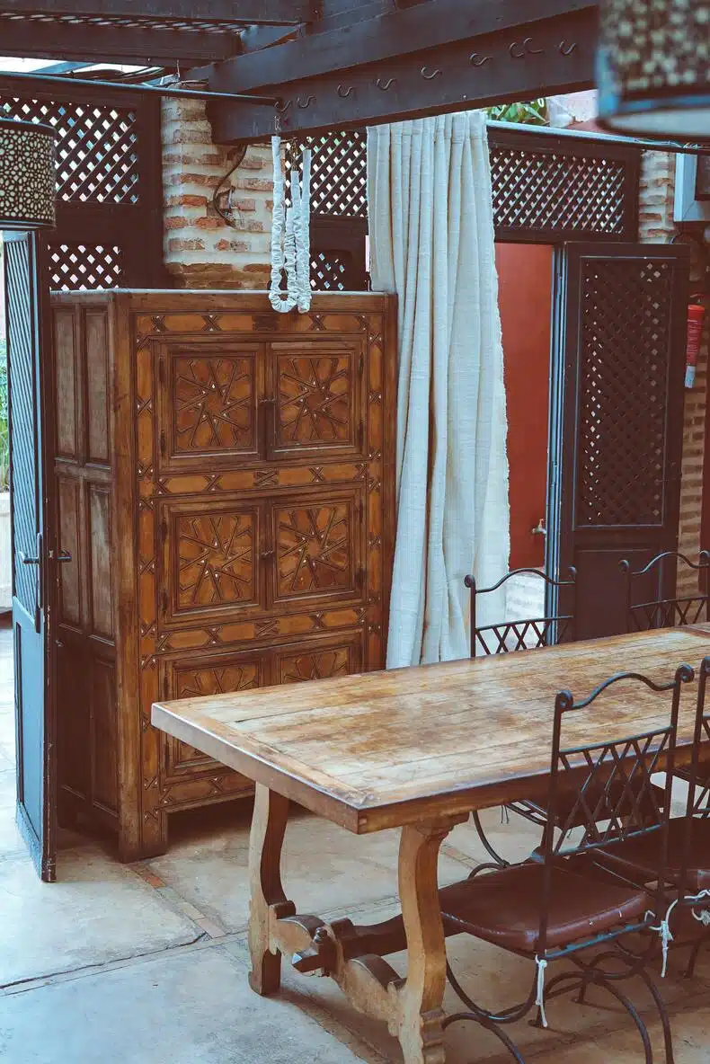 carved wooden furniture adding interest and charm to a Mediterranean interior design