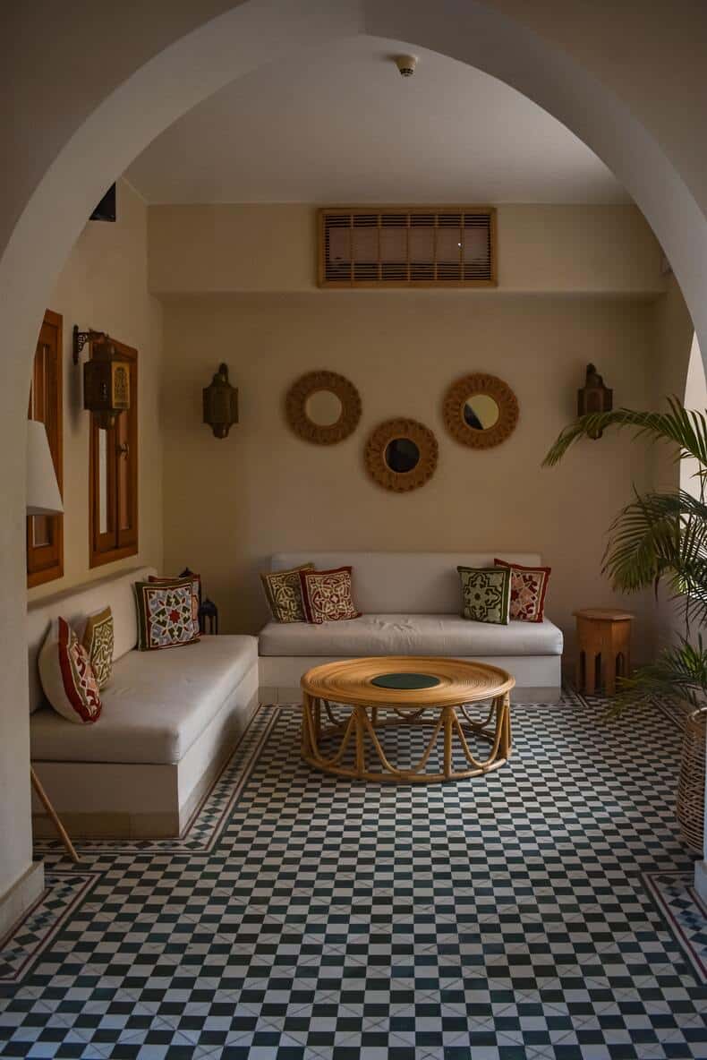 Mediterranean interior design, which uses bold patterns and bright colors, and incorporates popular materials like stone and terracotta to create a cozy oasis feel.