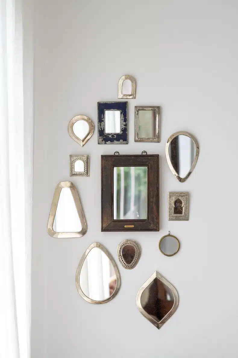 Decorate above kitchen cabinets with mirrors to make the space look larger and brighter