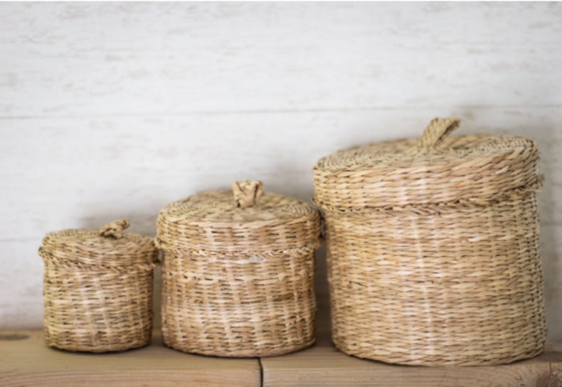 Woven baskets add texture and functionality to the space above your kitchen cabinets. Mix and match different sizes, shapes, and colors for a unique and eye-catching look