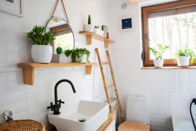 a minimalist bathroom with wall hangings and shelves providing extra storage and style