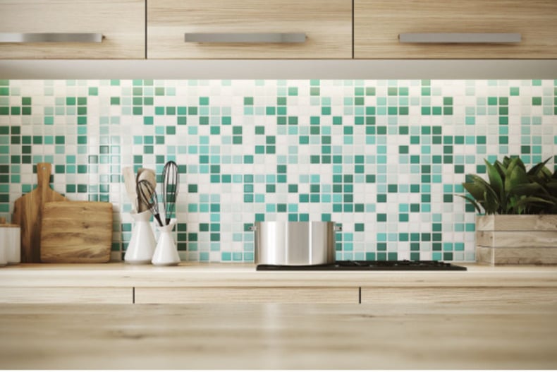 Colorful spillover-style kitchen backsplash with unique design