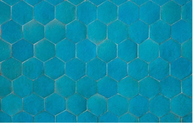 Boho chic teal hexagon tile backsplash adds a unique and stylish pop of color to the kitchen.