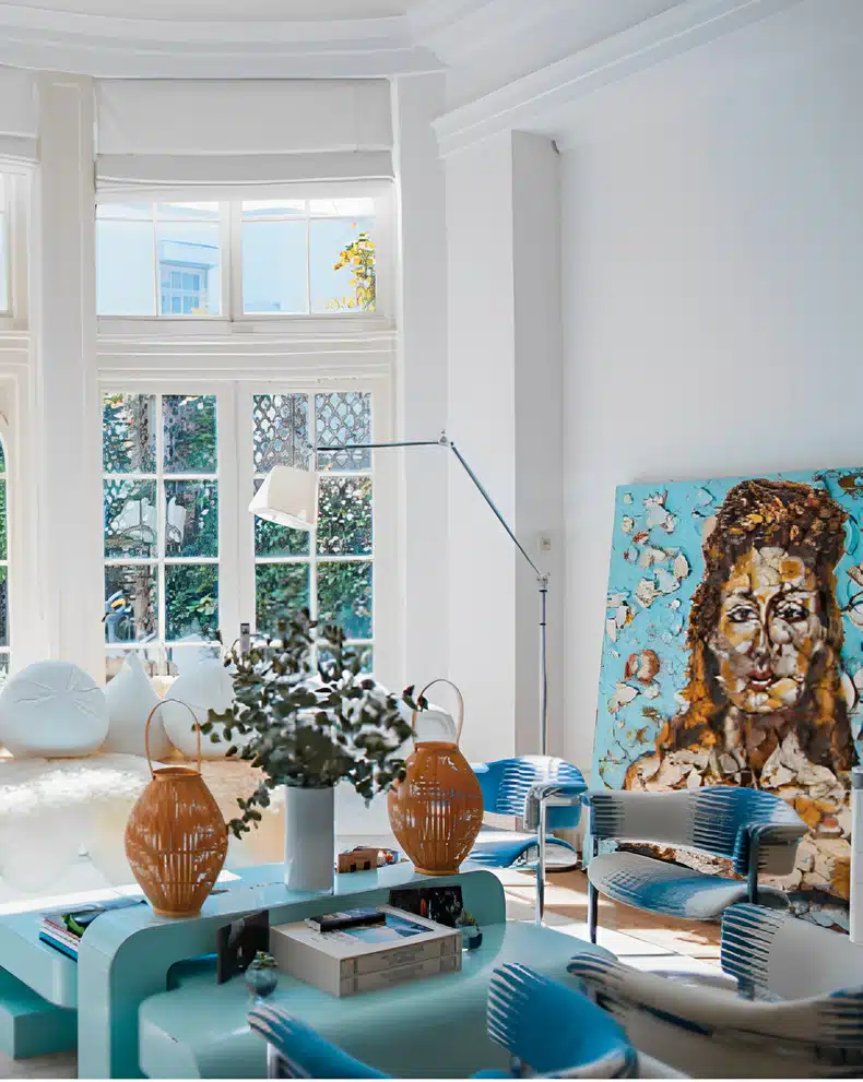 An interior decor setup featuring bold artwork and sculptures to creating a visually interesting and lively atmosphere 
