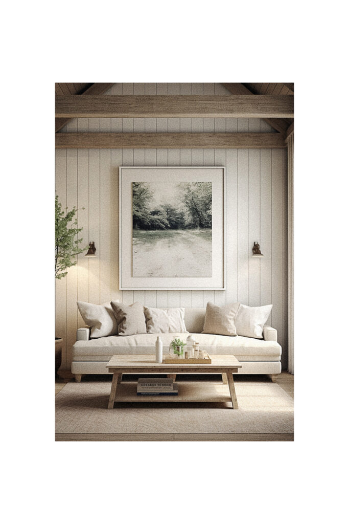 Modern farmhouse living room with wooden beams and a large painting.