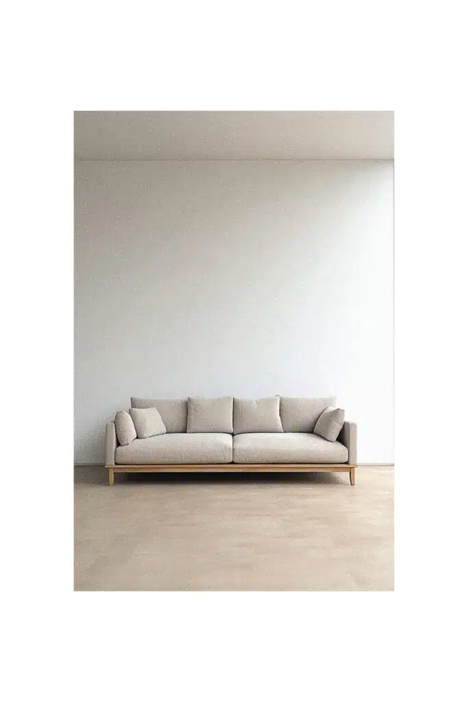 A simple sofa in a room with a white wall.