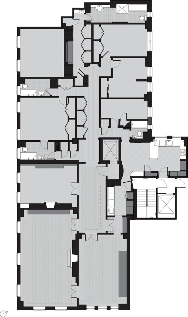 A floor plan of an apartment with two bedrooms and two bathrooms.