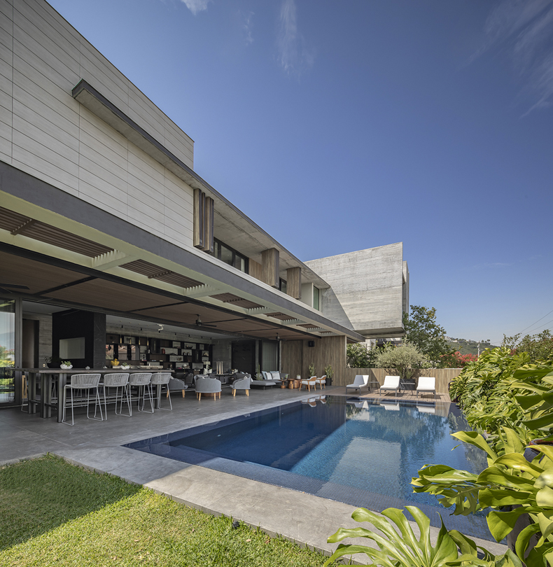 A modern house with a swimming pool and patio.
