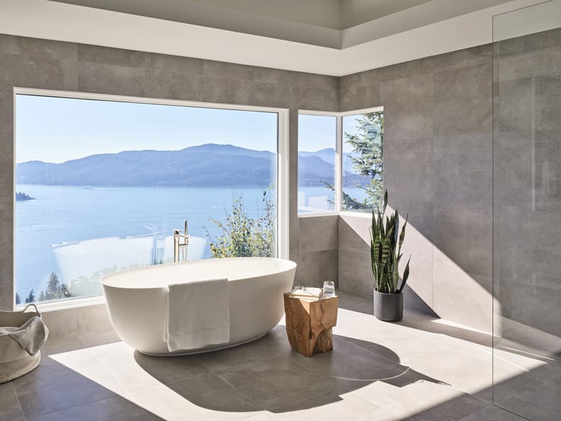 A bathroom with lakeside view.