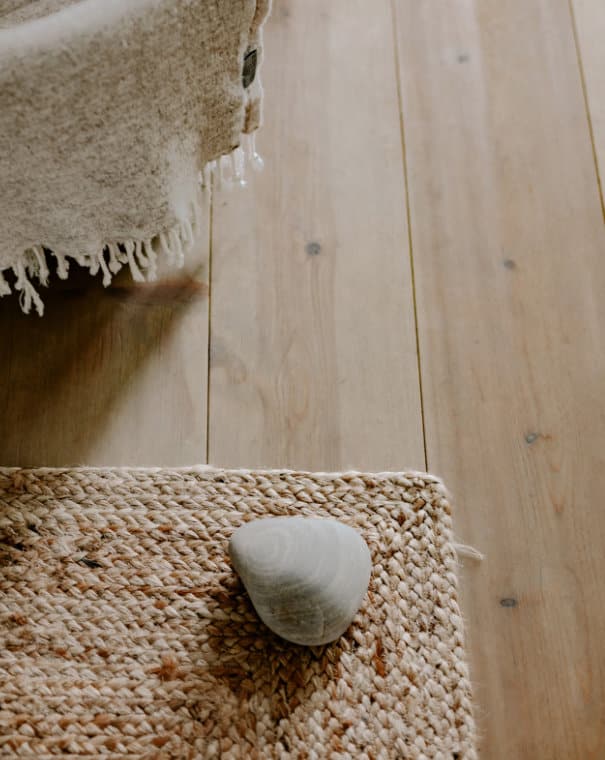 A chalet-inspired rock resting on a rug and chair.