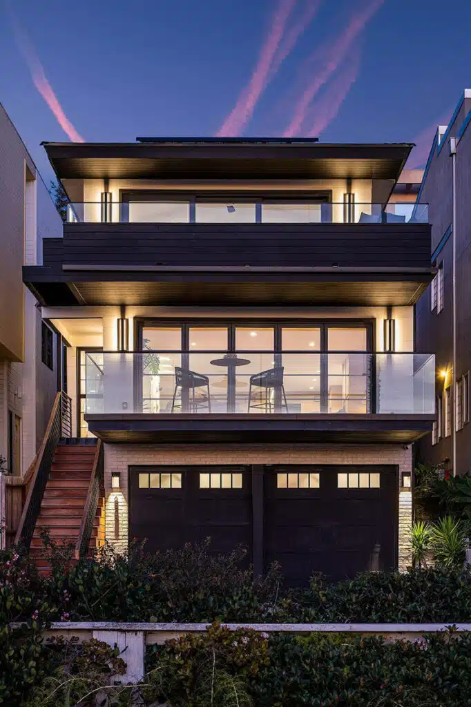 The exterior of a modern home at dusk.