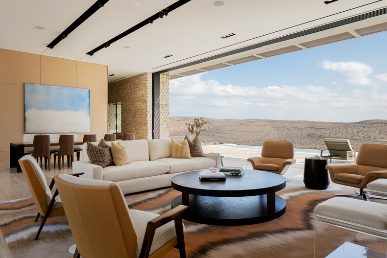 A modern living room with a view of the mountains.