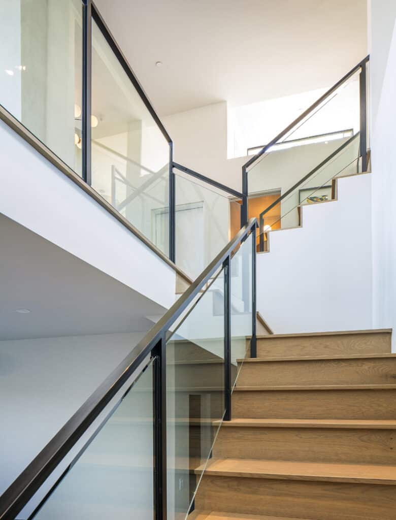 Glass stair railing in a modern home.