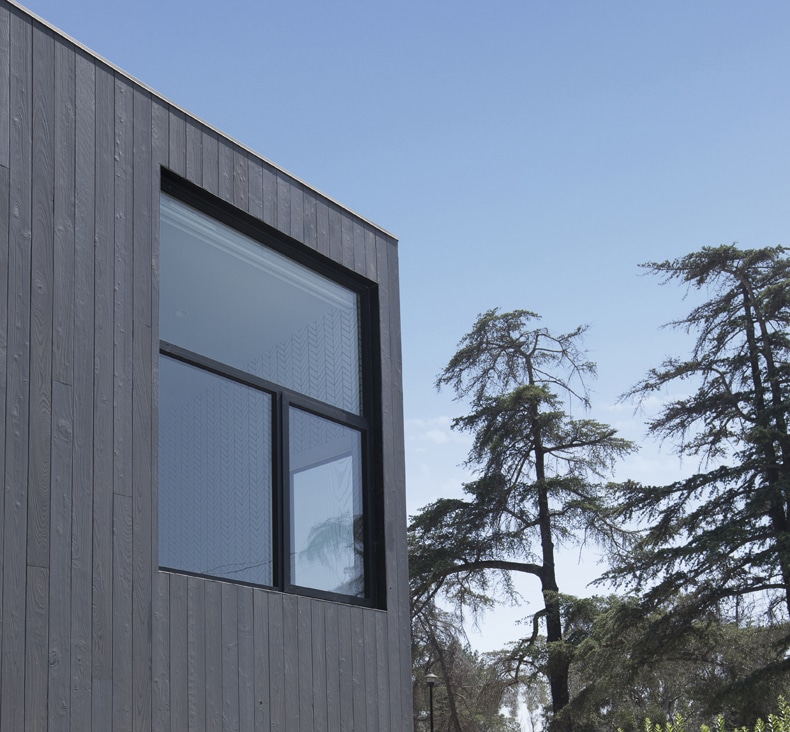 A modern house with a wooden exterior.