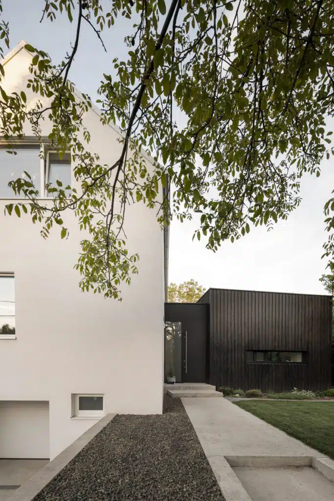A modern house with a black and white exterior.