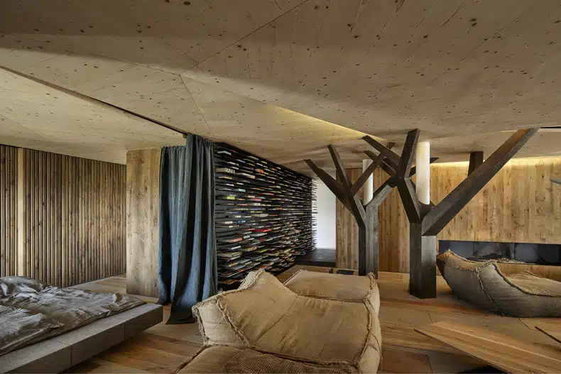 A room with wooden walls and a bed.