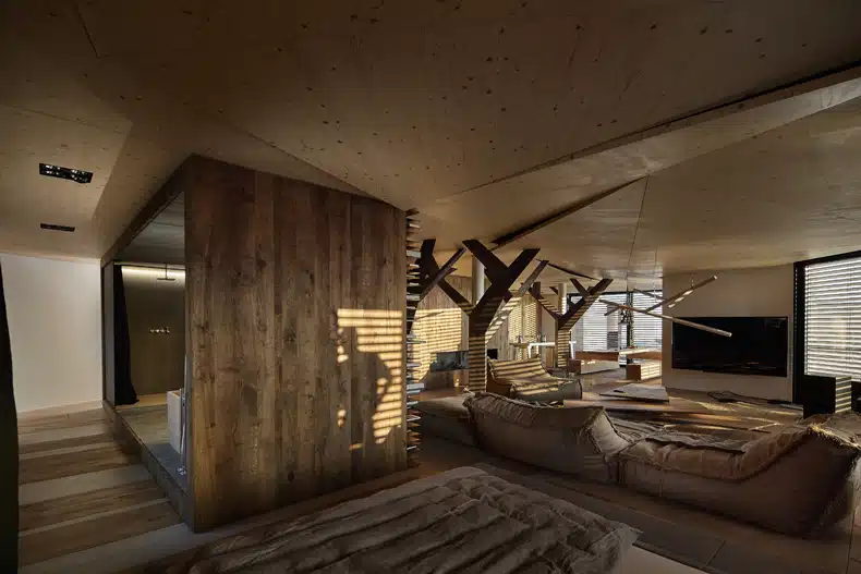 A living room with a wooden ceiling.