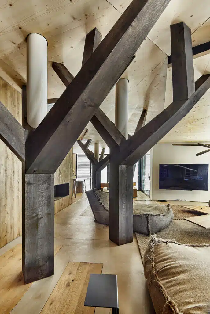 A living room with wooden beams and a couch.