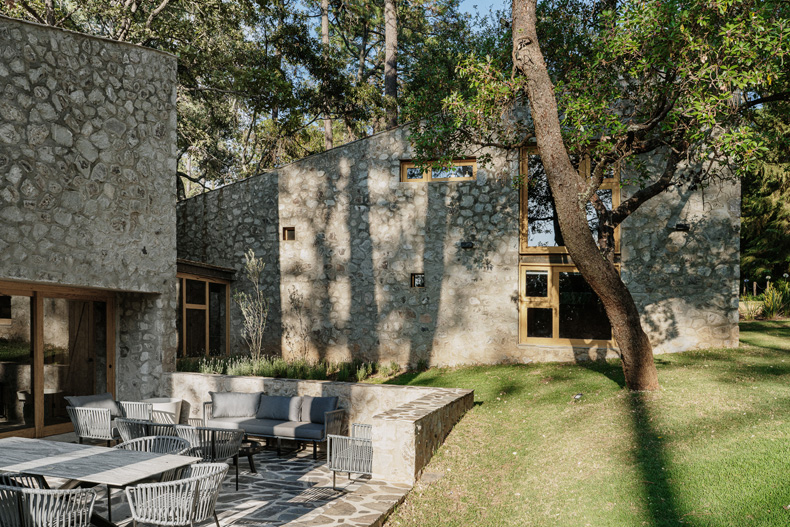Petraia House, nestled in the woods, is a stone retreat.