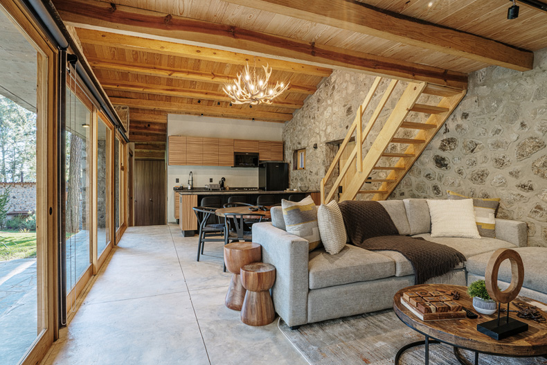 A Petraia House with a stone wall and wooden ceiling.
