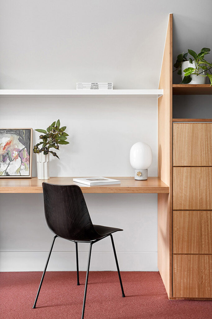 Twin Peaks House by Mihaly Slocombe featuring a home office with a desk and a chair.