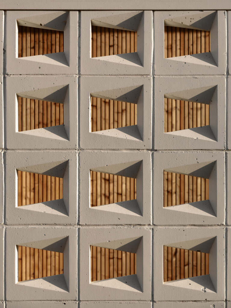 An image of a concrete wall with wooden panels.