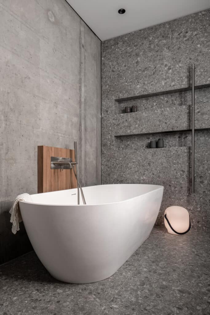 3D rendering of Zaricnyy Apartment's modern bathroom with a concrete floor.