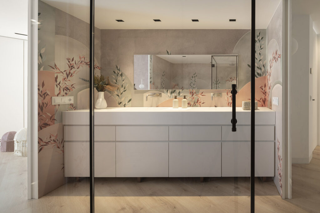 A bathroom with a glass door and floral wallpaper in the Citric House by Susanna Cots Interior Design.