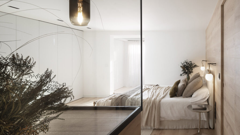 A bedroom with wooden floors in Citric House.