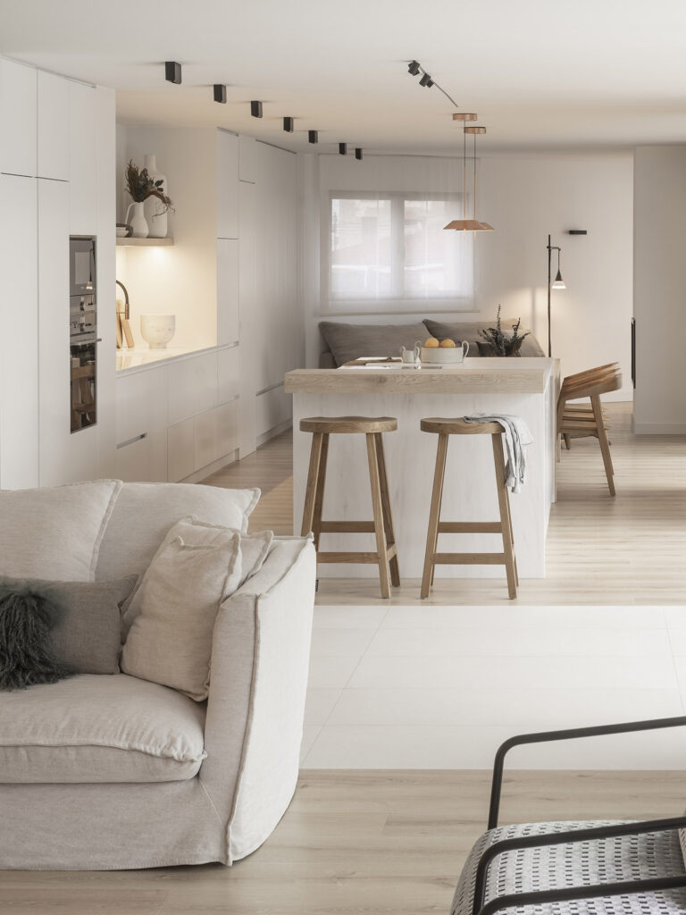 Citric House features a white kitchen and living room with wooden floors.