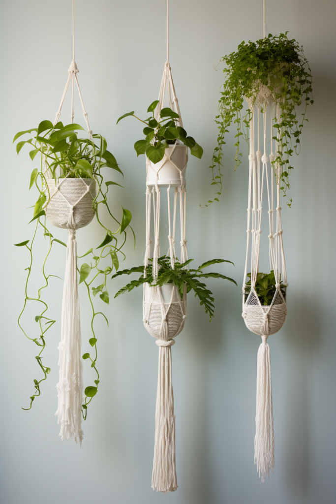 Enhance your interior design with four hanging planters adorned with tassels and plants.