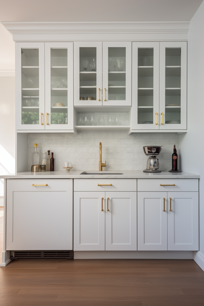 A kitchen with white cabinets and gold hardware, following the interior design trends of 2024.