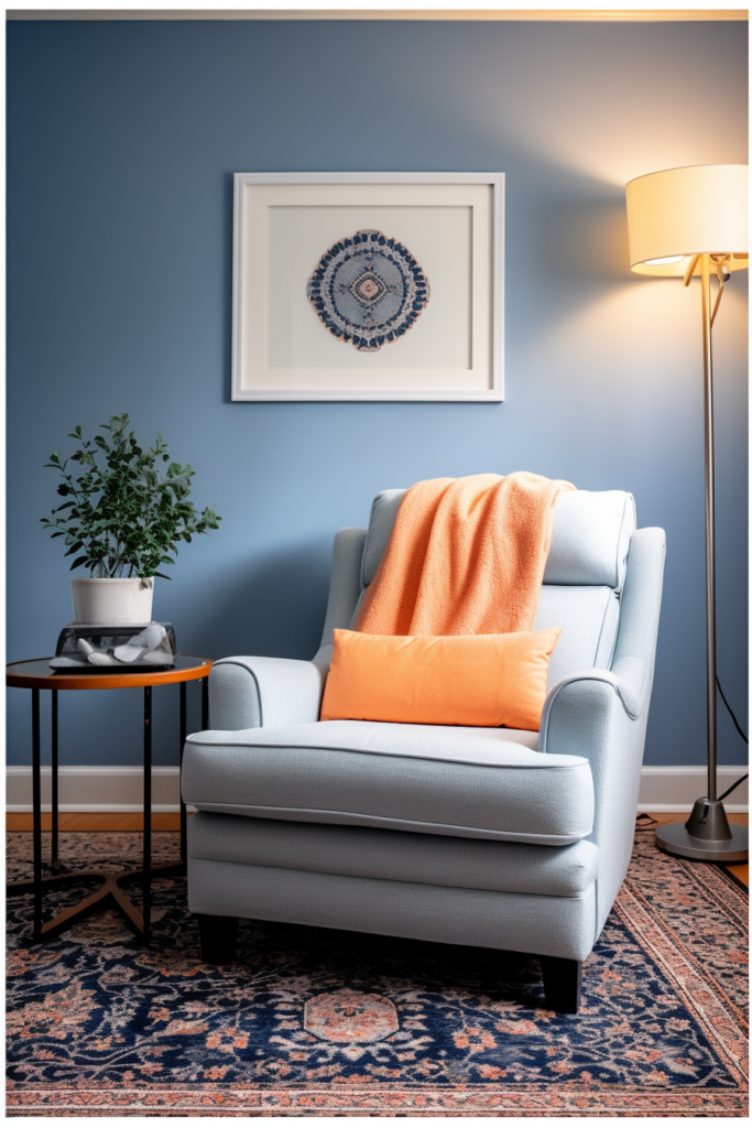 A chair in a room with blue walls and orange pillows that perfectly combine three colors and go together.