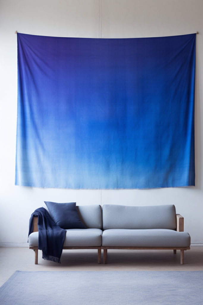 A serene Japanese tapestry acts as elegant wall art, hanging above a couch in a living room.
